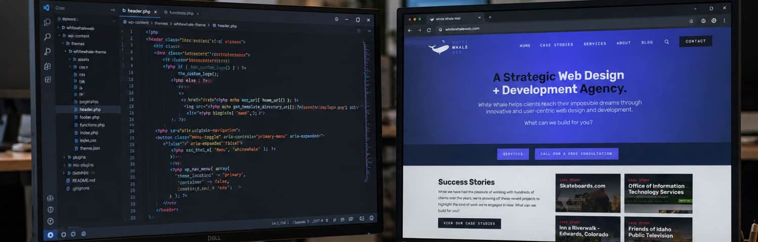Developer working on custom WordPress theme code with the White Whale Web website displayed on a second monitor